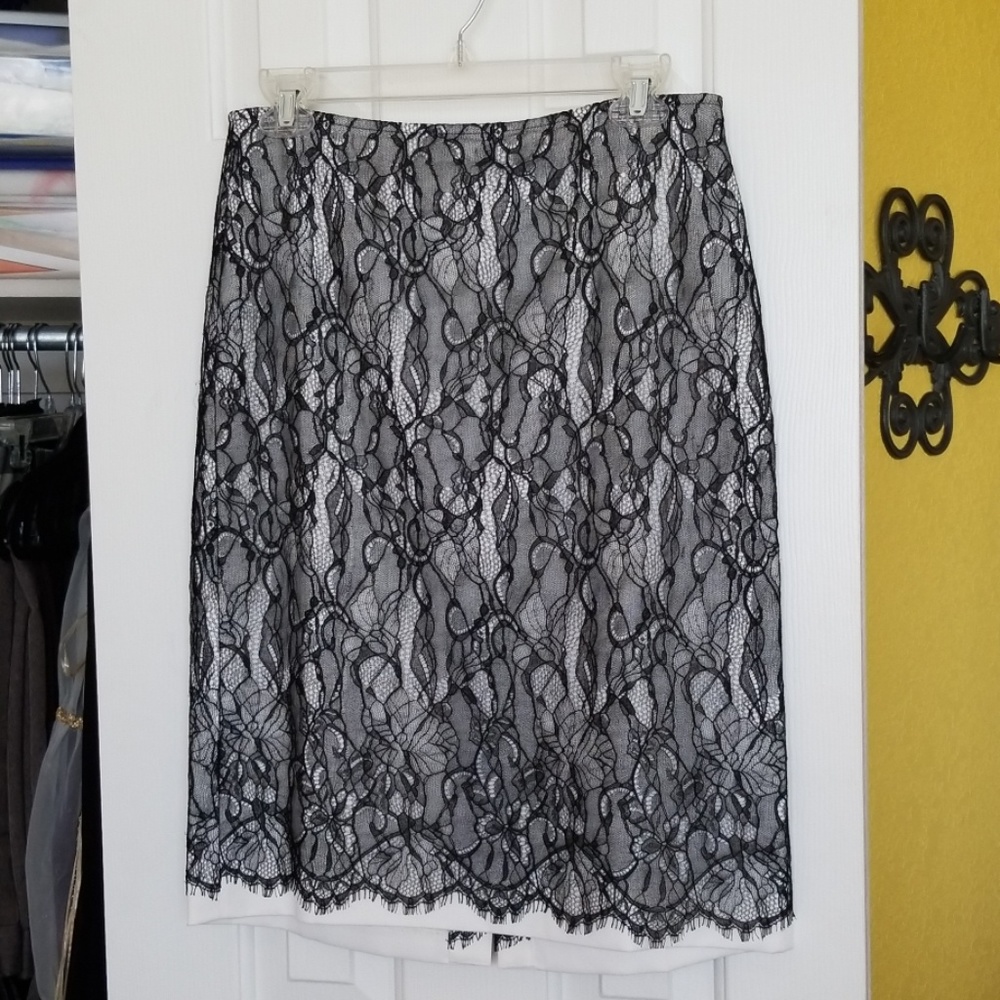 Black lace over white satin skirt